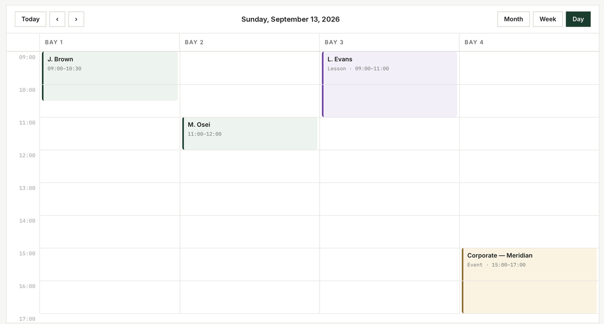 Calendar day grid: bay columns with booking blocks